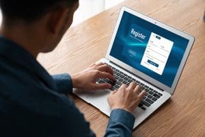 Website Form Errors shown by a user on a laptop on a desk