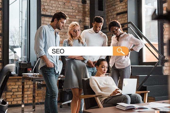 Design Agency looking at a laptop screen and viewing SEO Ranking