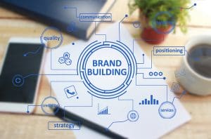 Repositioning Your Brand for a New Target Audience -  Brand Reposition, A Brand building graph on top of a desk.