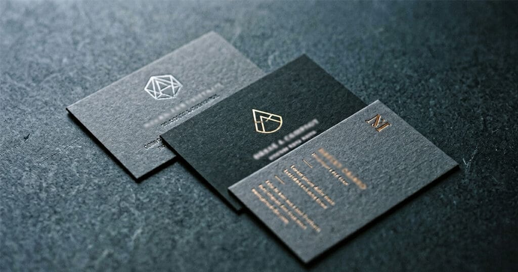 Three inconsistent business cards representing NAP inconsistency and branding mismatches that hurt local SEO rankings